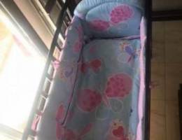 Dark brown baby bed