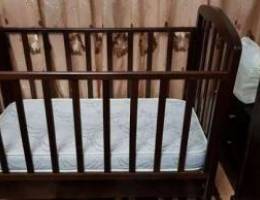 wooden crib and cabinet