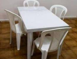 big plastic table with 6 chairs