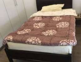 a used bed with its mattress for sale