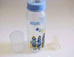 Nuk baby bottle with extra top and pacifie...