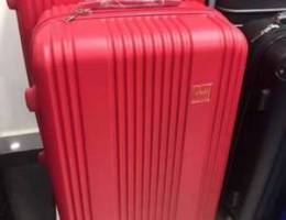 Swiss Travel Suitcase Red color. travel ba...