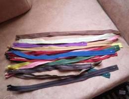 Zippers for clothes in different colors an...