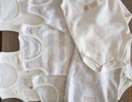 Set of 7 sleeveless bodysuits, 3-6 months